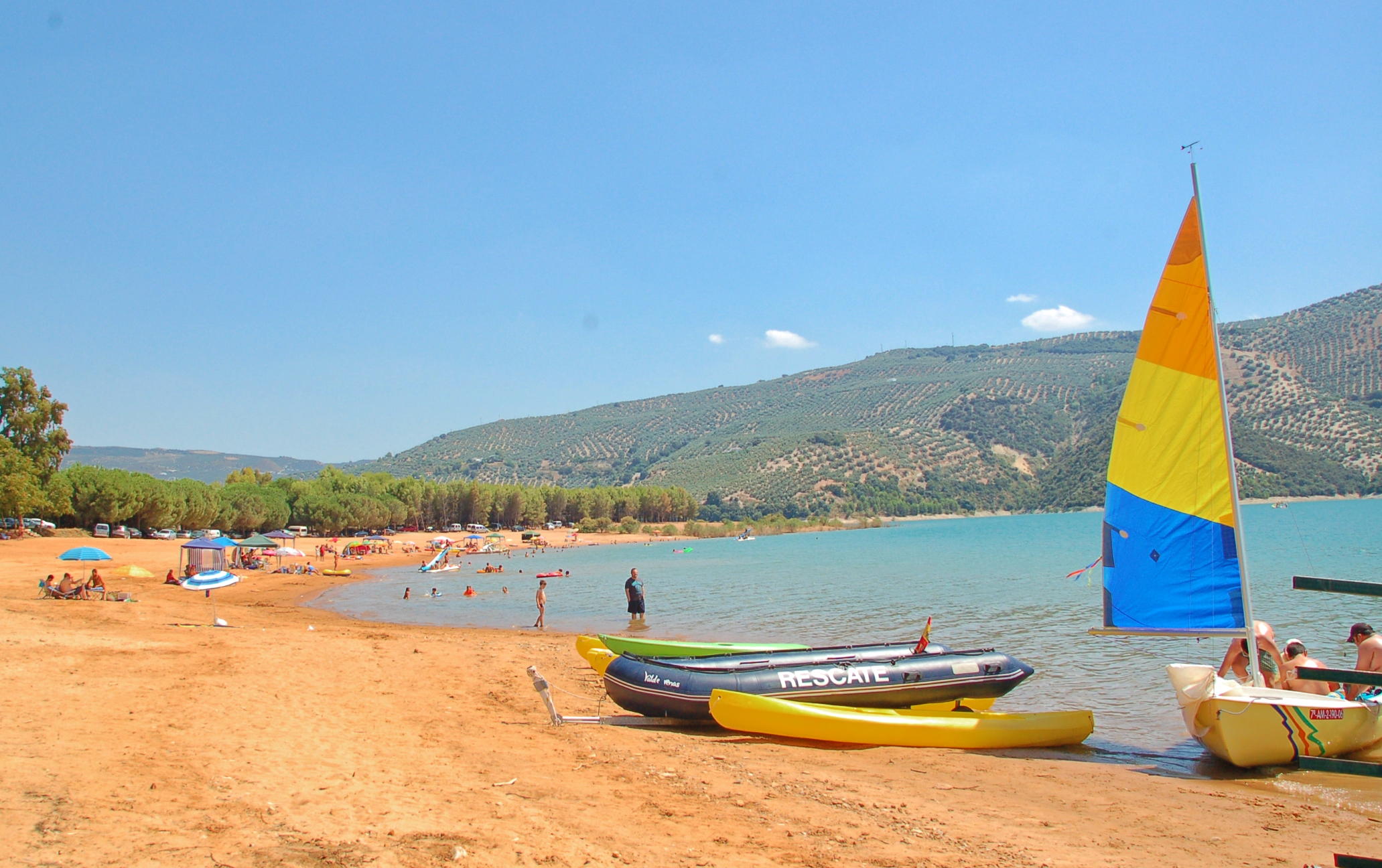 Beach playa Iznajar Andalucia Swim sail Kayaks pedalos